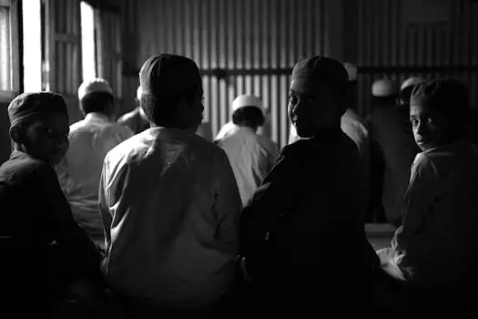 A group of children in traditional attire seated indoors, Bangladesh.